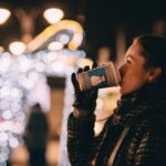 Woman sipping warm beverage