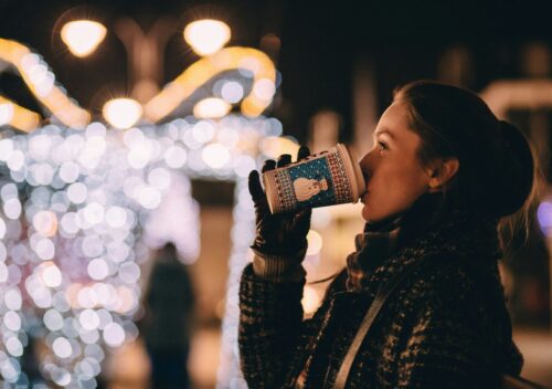 Woman sipping warm beverage