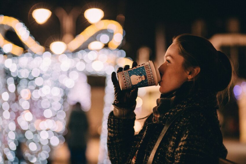 Woman sipping warm beverage